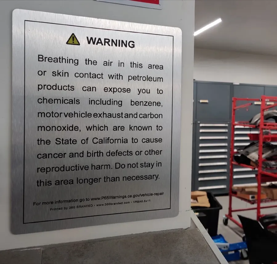 Proposition 65 warning on brushed aluminum in a service area